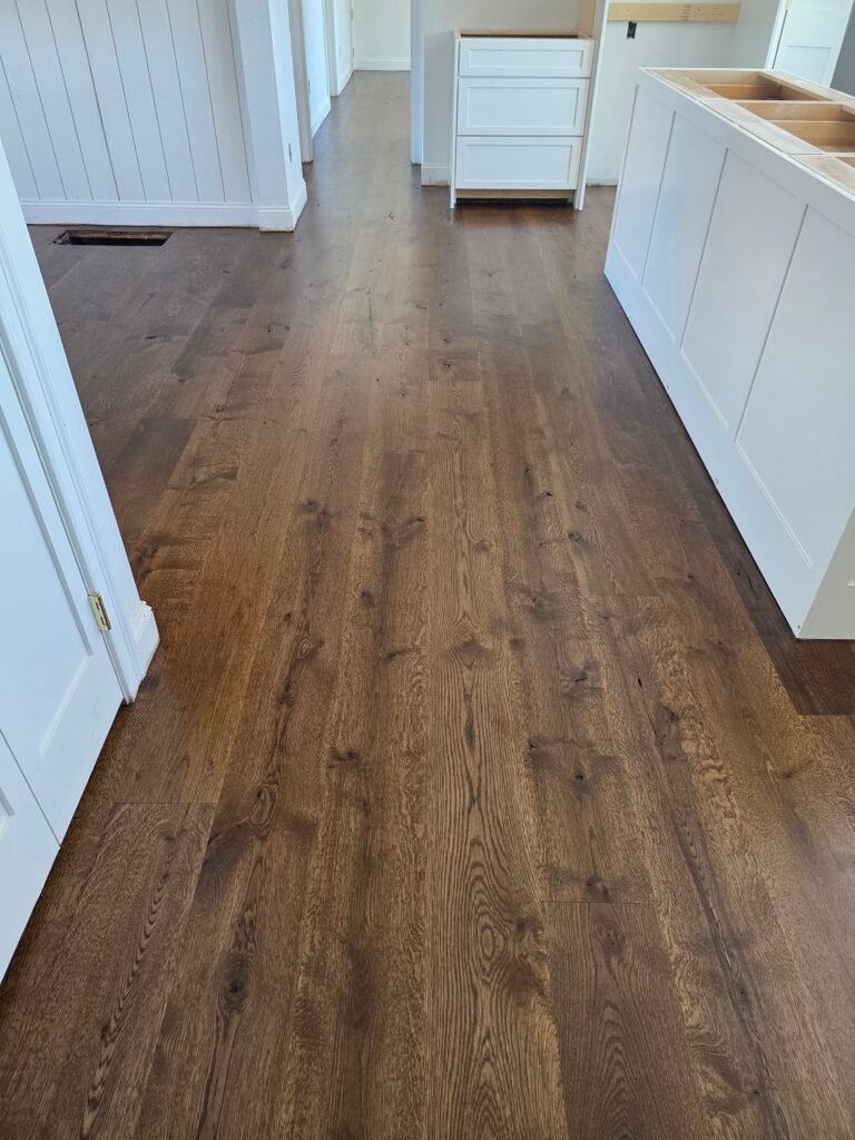 Finished hardwood floor in a hallway — I&P Flooring project