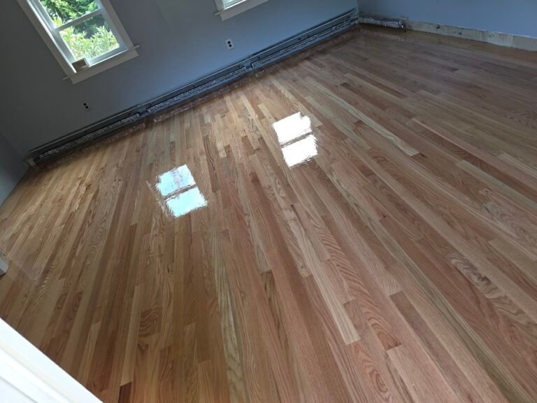 Finished hardwood floor in a room — I&P Flooring project