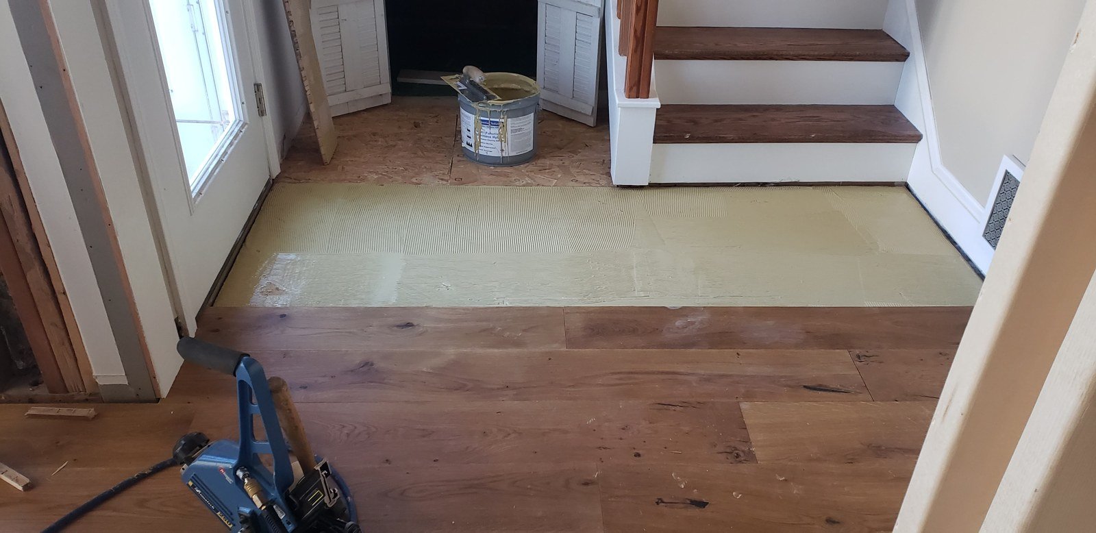 Wood flooring installation near stairs — I&P Flooring project